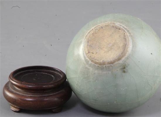 A Chinese Longquan celadon ovoid jar, Song - Yuan dynasty, 7.5cm, wood stand